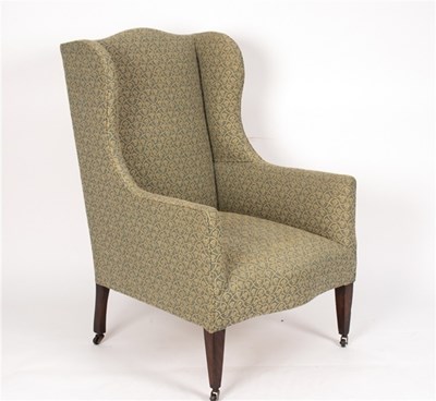 Lot 451 - A Victorian wing back armchair on square taper...