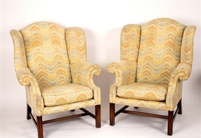 Lot 452 - A pair of George III style wing back armchairs,...