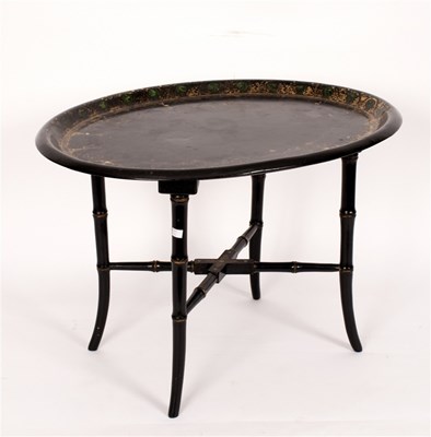 Lot 454 - An oval papier-mache tray, mounted as a table...