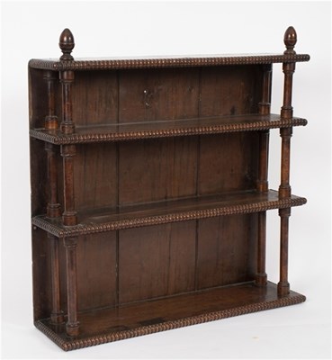 Lot 465 - A mahogany hanging bookcase of three shelves...