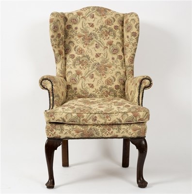 Lot 478 - An early 19th Century wing back chair, on...