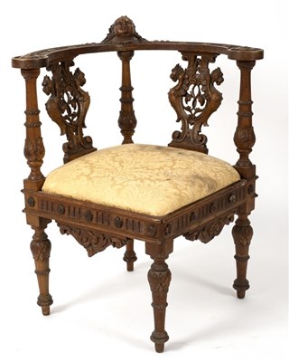 Lot 482 - A 19th Century oak library chair profusely...
