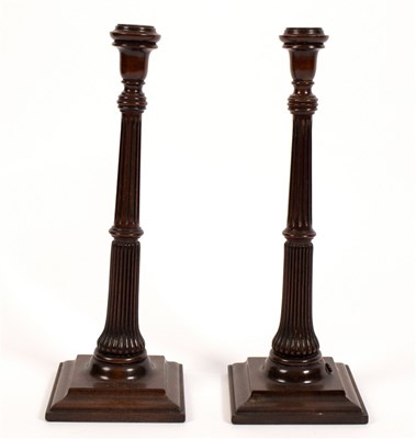 Lot 500 - A pair of mahogany table lamps with fluted...