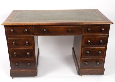 Lot 501 - A mahogany kneehole desk fitted a surround of...