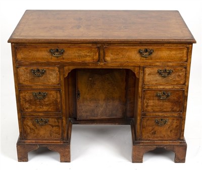 Lot 510 - An 18th Century style walnut kneehole desk,...