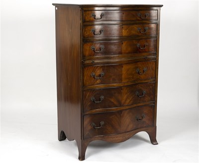Lot 513 - A reproduction serpentine front chest of six...