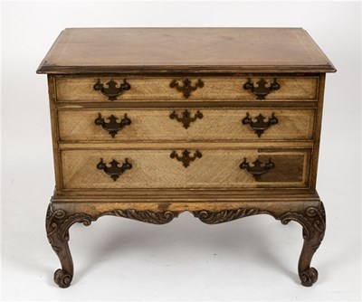Lot 514 - A Gillow chest of three drawers on carved...