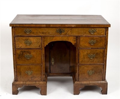 Lot 540 - A George I style walnut veneered kneehole desk...