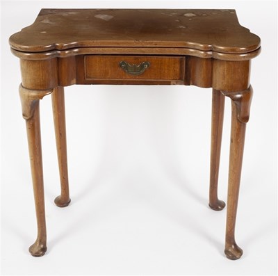 Lot 542 - A George III mahogany fold-over games table,...