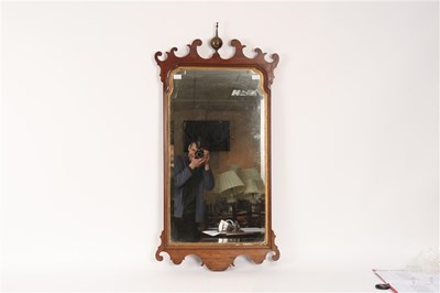 Lot 547 - A George III mahogany fret carved wall mirror,...