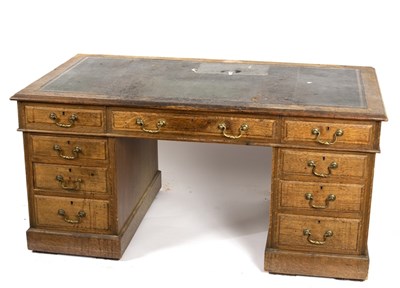 Lot 549 - A late Victorian oak pedestal desk fitted a...