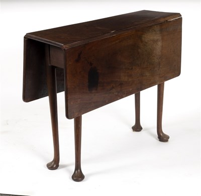 Lot 553 - A George III mahogany drop flap table on pad...
