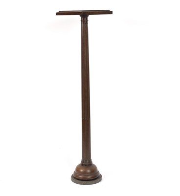 Lot 568 - A 19th century mahogany torch??re with fluted...