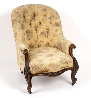 Lot 569 - A Victorian walnut framed button back armchair...