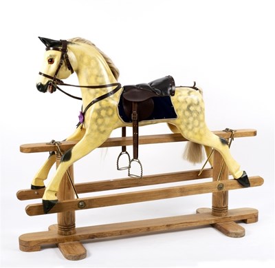 Lot 581 - A child's rocking horse on a pine stand
