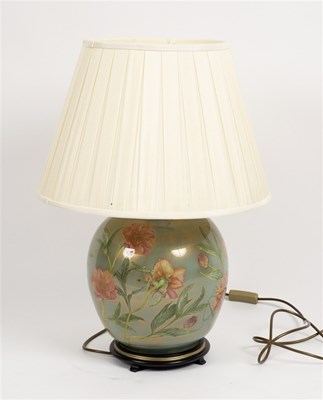 Lot 582 - A large floral pottery table lamp with shade