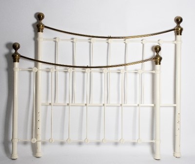 Lot 588 - A cast iron and brass bedstead with white...