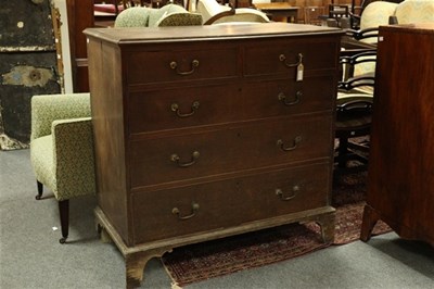 Lot 600 - A George III oak chest of two short over three...