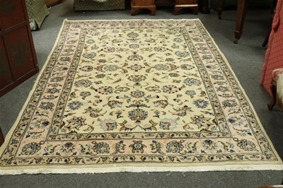 Lot 618 - A Kashan rug, the floral field to a cream...