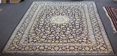 Lot 619 - A Kashan carpet, the central pale blue...