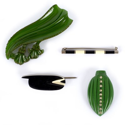 Lot 15 - Two green Bakelite brooches of foliate form...