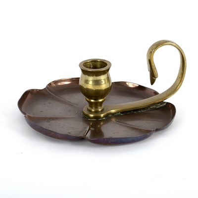 Lot 108 - An Arts and Crafts style copper candle holder...