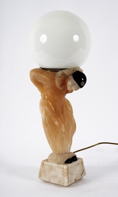 Lot 153 - An Art Deco style lamp styled in alabaster as...