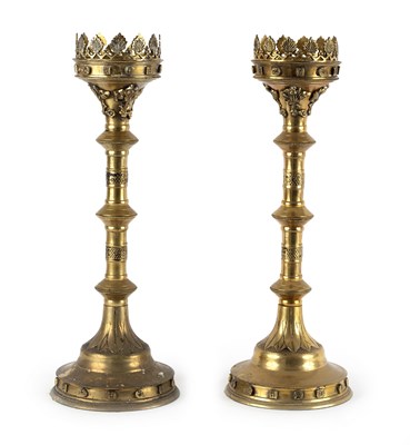 Lot 159 - A pair of Gothic Revival brass candlesticks,...