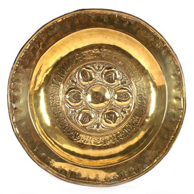 Lot 11 - A Nuremberg brass alms dish with embossed...