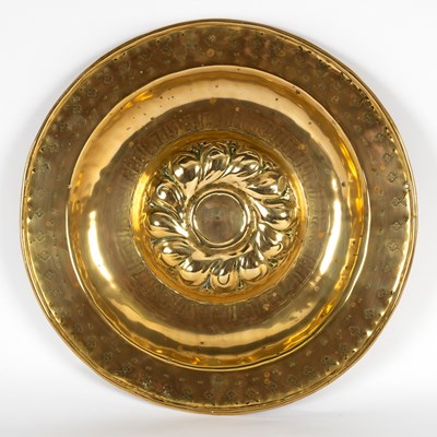 Lot 12 - A Nuremberg brass alms dish with embossed...