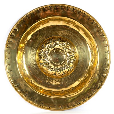 Lot 13 - A Nuremberg brass alms dish with embossed...