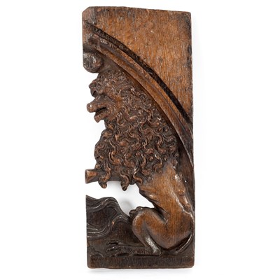 Lot 17 - A 17th Century panel fragment carved a lion,...