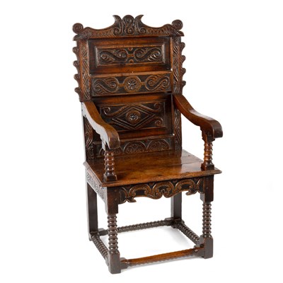 Lot 27 - A Charles II oak open armchair, the scrollwork...