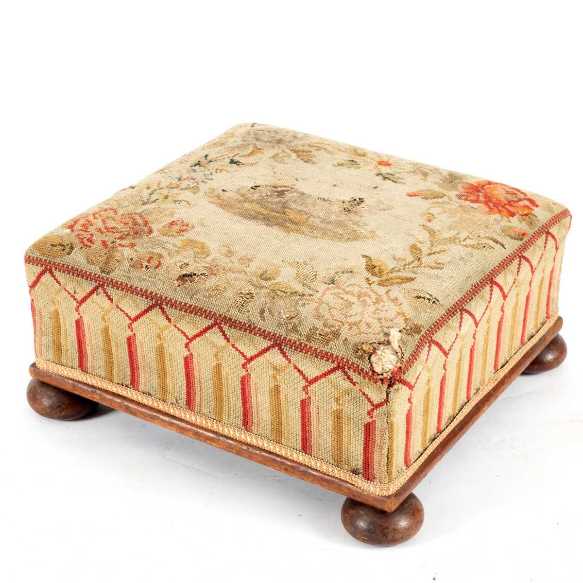 Lot 32 - A Victorian upholstered footstool on bun feet,...