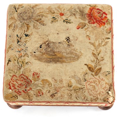 Lot 32 - A Victorian upholstered footstool on bun feet,...