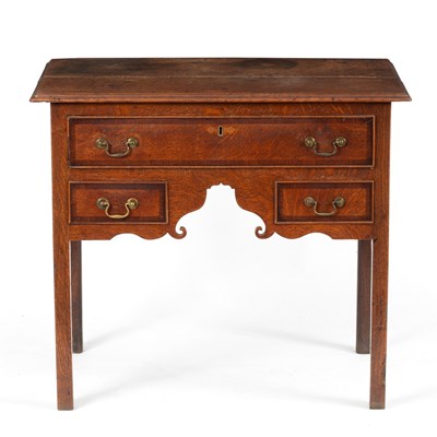 Lot 55 - An oak kneehole desk fitted three drawers on...