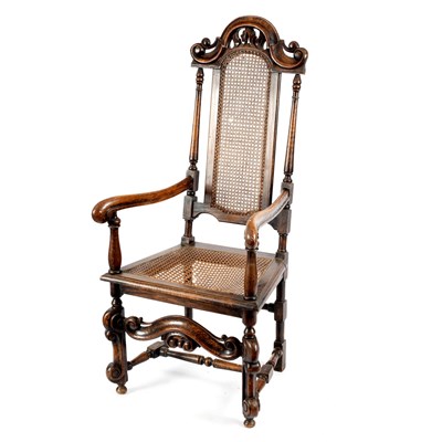 Lot 57 - A walnut armchair of Carolean design with cane...