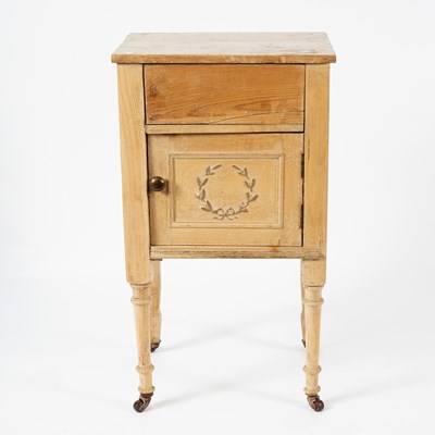 Lot 107 - A pine bedside table carved a wreath to the...