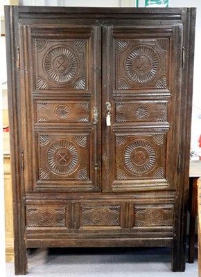 Lot 118 - A French 18th Century oak armoire, enclosed by...