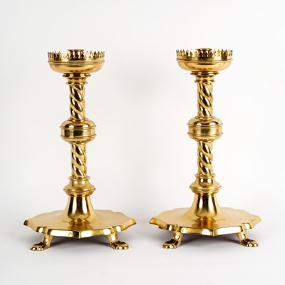 Lot 119 - A pair of brass Gothic revival candlesticks...