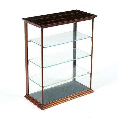 Lot 121 - A rectangular glazed cabinet fitted adjustable...