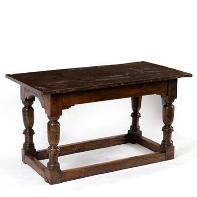 Lot 140 - An oak table with associated triple plank top...