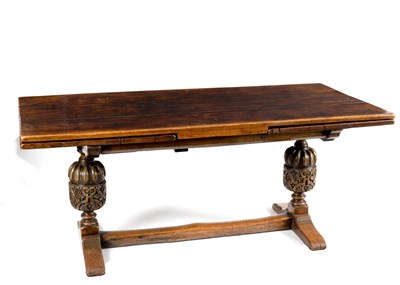 Lot 142 - An oak draw-leaf dining table, 334cm extended