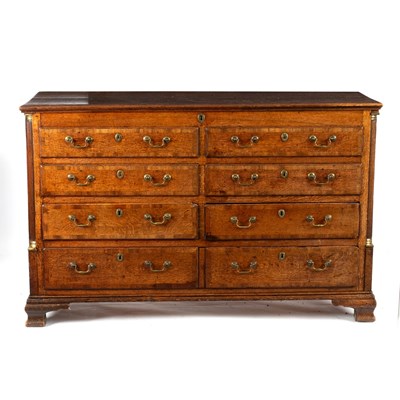 Lot 147 - An oak blanket chest fitted four false drawers...