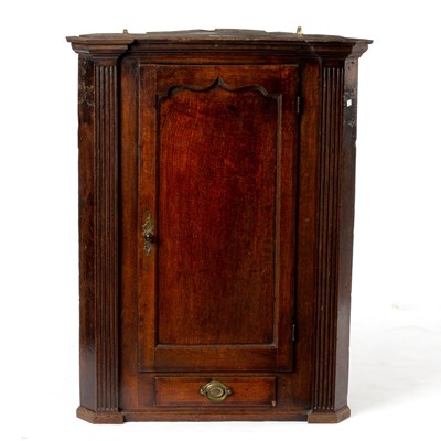 Lot 149 - An early 19th Century oak corner cupboard,...