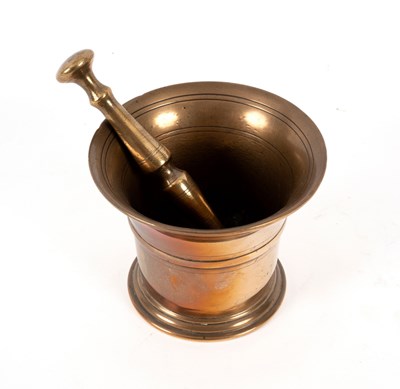 Lot 194 - A brass pestle and mortar, 14.5cm high