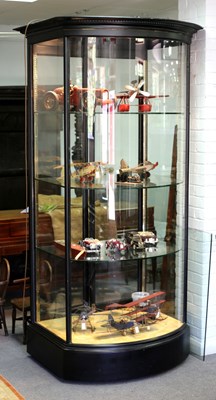 Lot 209 - A large bowfronted glazed display cabinet...