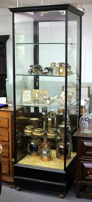 Lot 211 - A glazed display cabinet fitted lights to the...