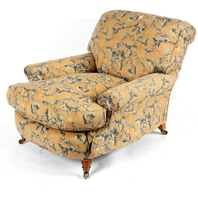 Lot 212 - A Howard armchair on turned front legs,...