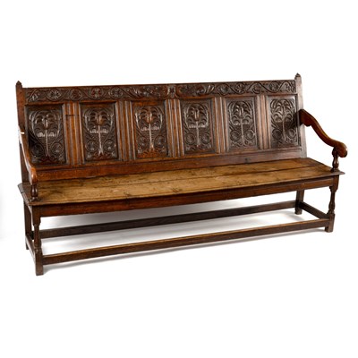 Lot 230 - An oak six-panel back settle, circa 1700,...